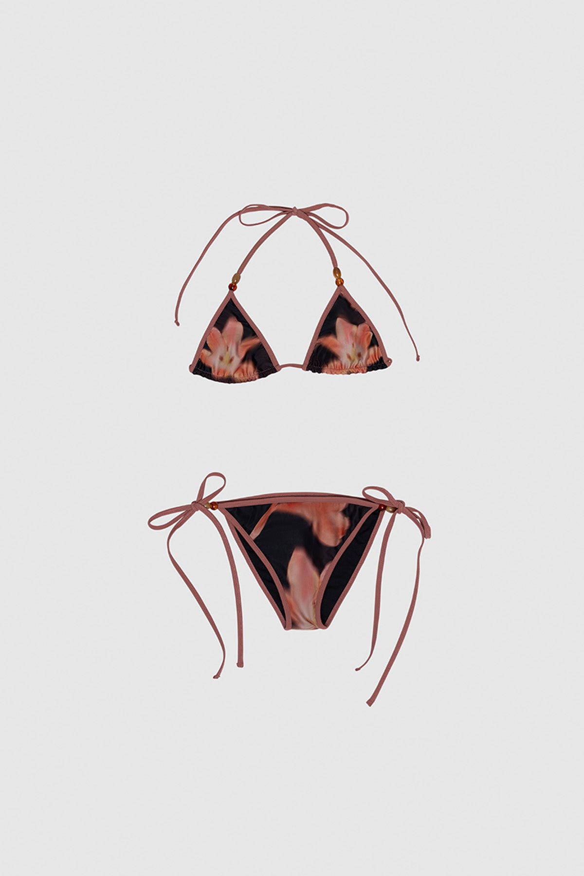 Brown floral triangle bikini set with beaded drawstrings and adjustable ties by The Wolf Gang, perfect for summer getaways.