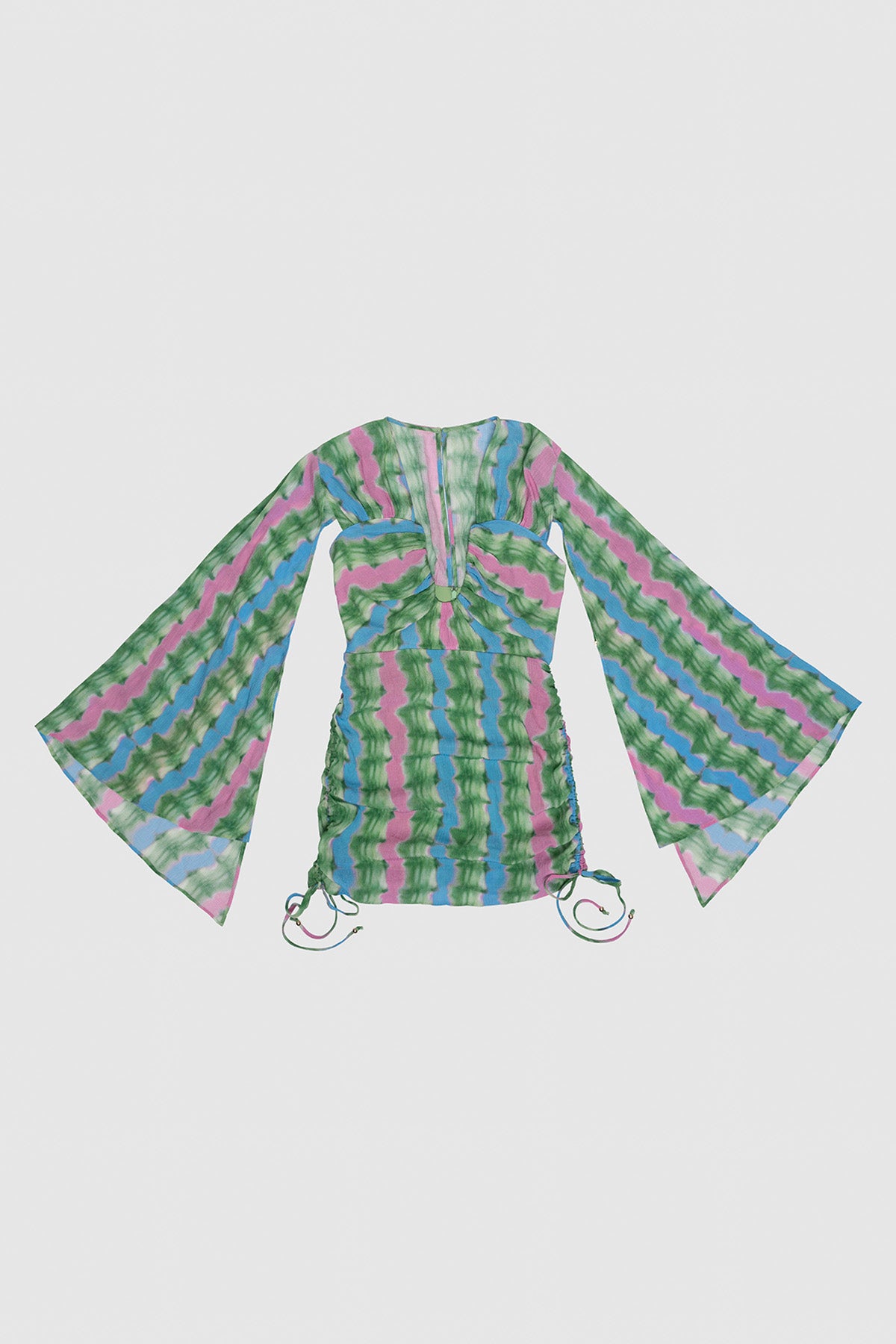 Colorful patterned top with bell sleeves on a light gray background