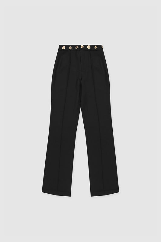 Women’s highwaisted Black Noir Irida Bootcut Pants with pin tuck detail and embroidered waistband—wear solo or as a matching set with Irida Vest Dress.