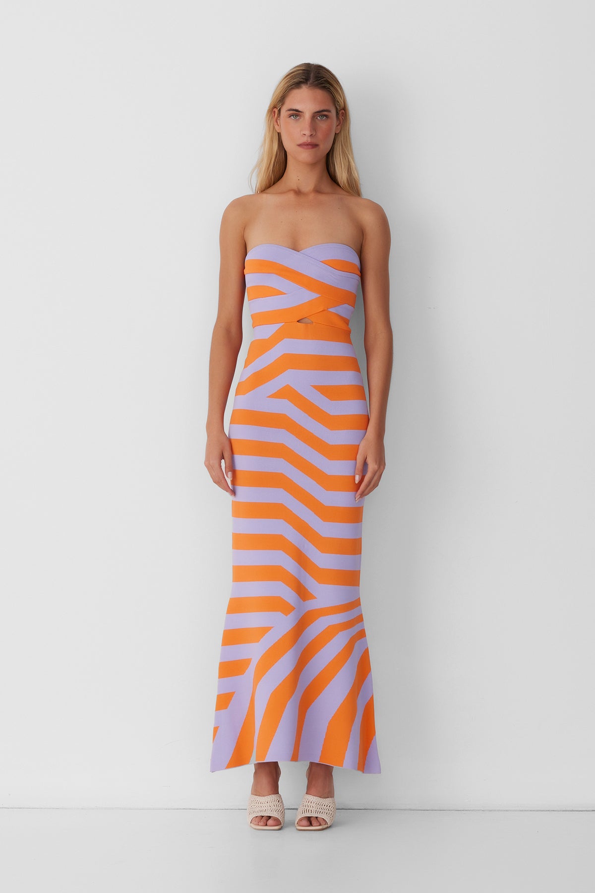 Women’s strapless Maxi Lilac Aude Dress with two-tone knit in Orange and Purple fitted silhouette gold back zip and flared hemline.
