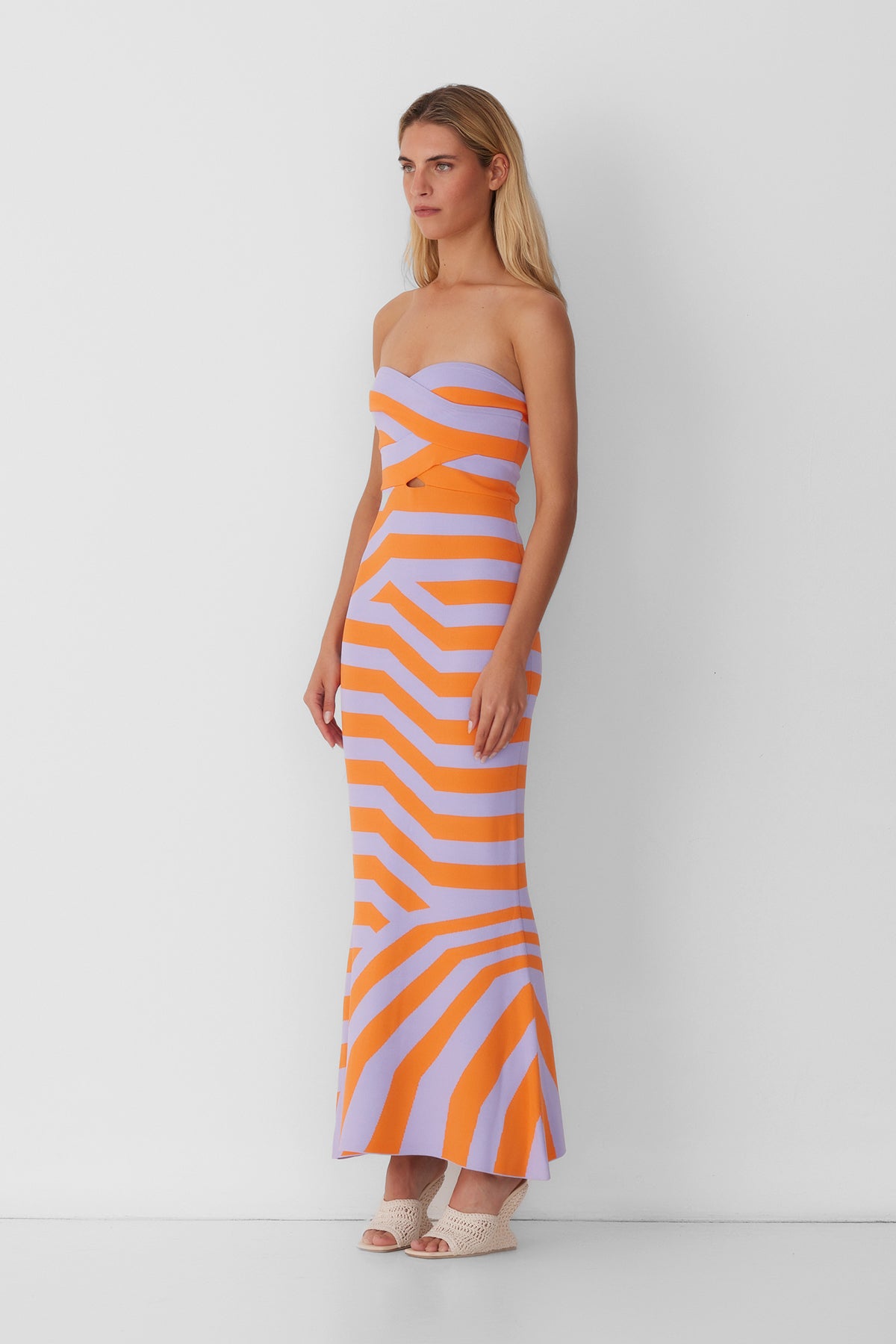 Women’s strapless Maxi Lilac Aude Dress with two-tone knit in Orange and Purple fitted silhouette gold back zip and flared hemline.