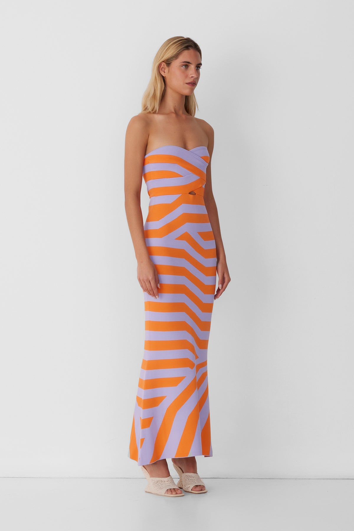 Women’s strapless Maxi Lilac Aude Dress with two-tone knit in Orange and Purple fitted silhouette gold back zip and flared hemline.