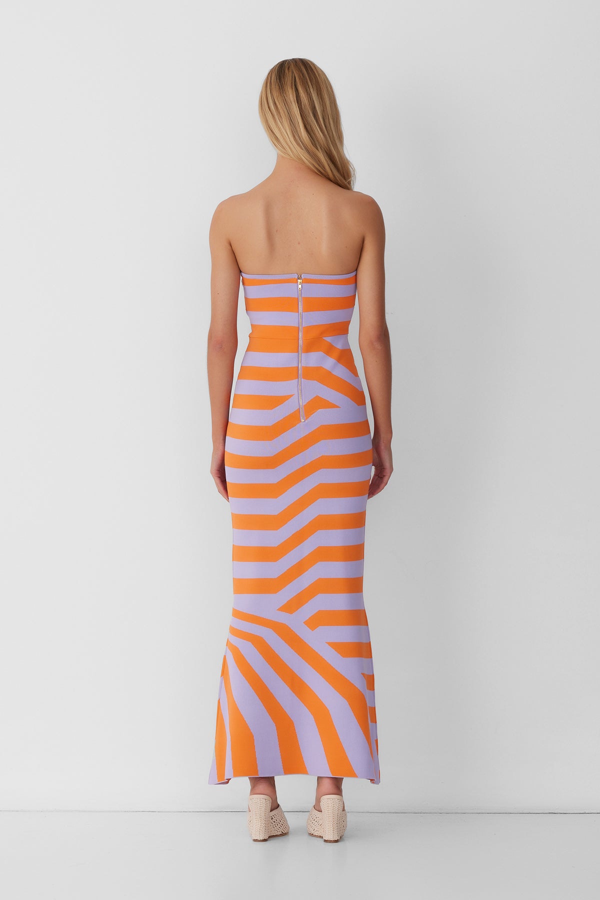 Women’s strapless Maxi Lilac Aude Dress with two-tone knit in Orange and Purple fitted silhouette gold back zip and flared hemline.