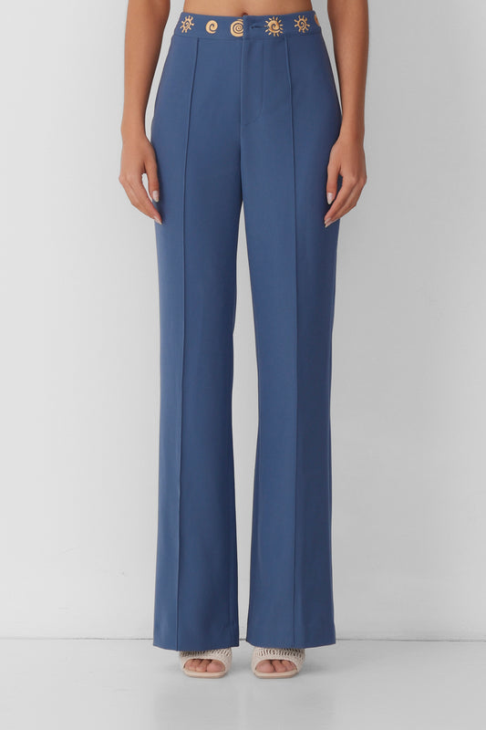 Women’s highwaisted Navy Blue Stone Irida Bootcut Pants with pin tuck detail and embroidered waistband—wear solo or as a matching set with Irida Vest Dress.