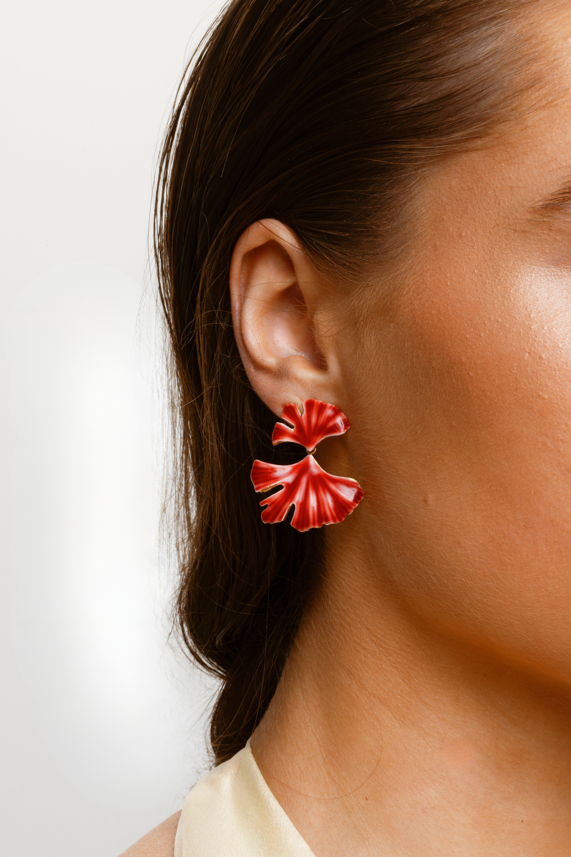 Red stud earrings with gold-sprayed sterling silver hardware, perfect for gifting.