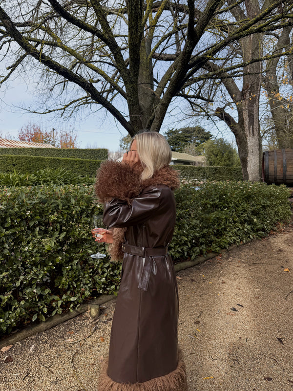 Dani wears the Abrigo Coat in size S