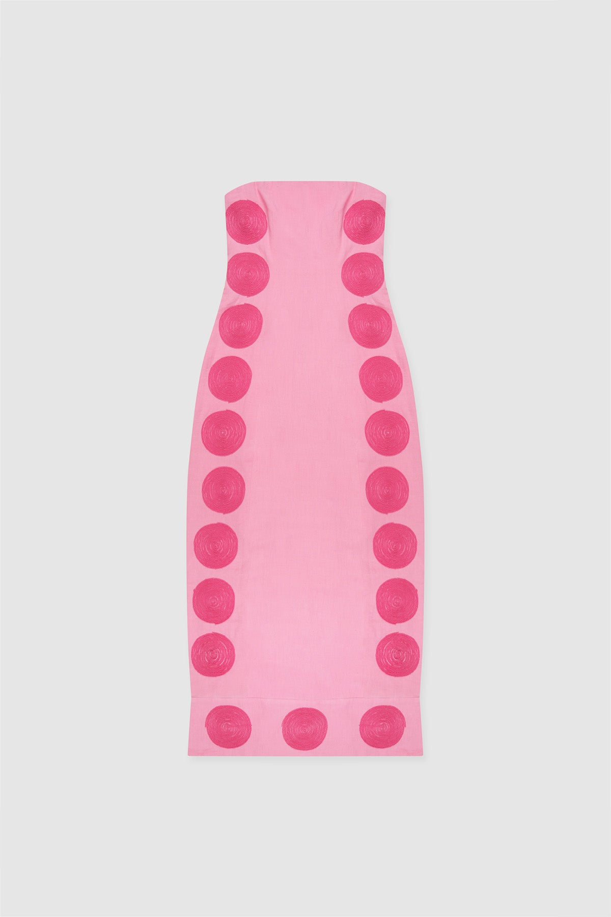 Woman wearing Pink linen cotton maxi dress with contrast embroidery and shaped bust.