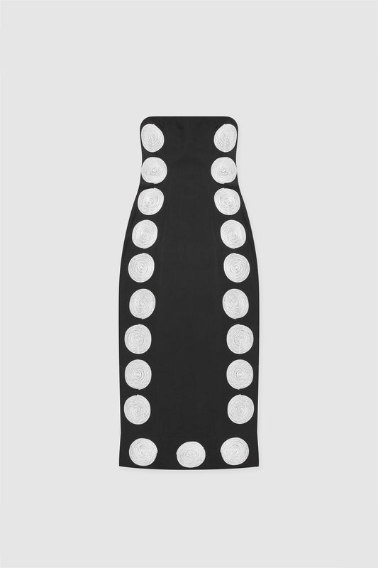 A black maxi dress with white contrast embroidery in a dotted pattern