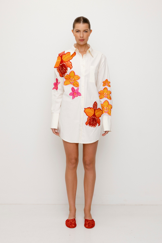 Women’s oversized White Ela Shirt Dress in 100 percent cotton with custom floral embroidery gold beaded ties and boxy mini-length fit