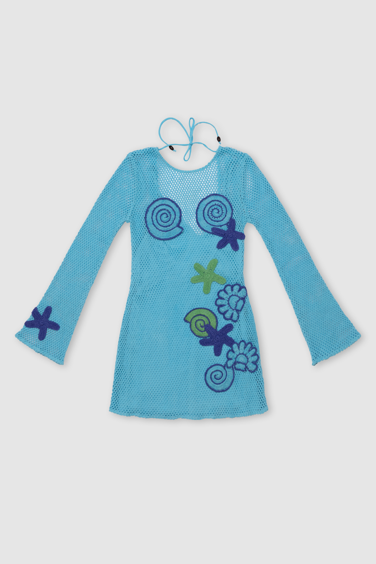 Women’s Blue Enza Mini Dress with handmade sea-themed crochet motifs, detachable slip lining, bell-shaped long sleeves, and bright prints.