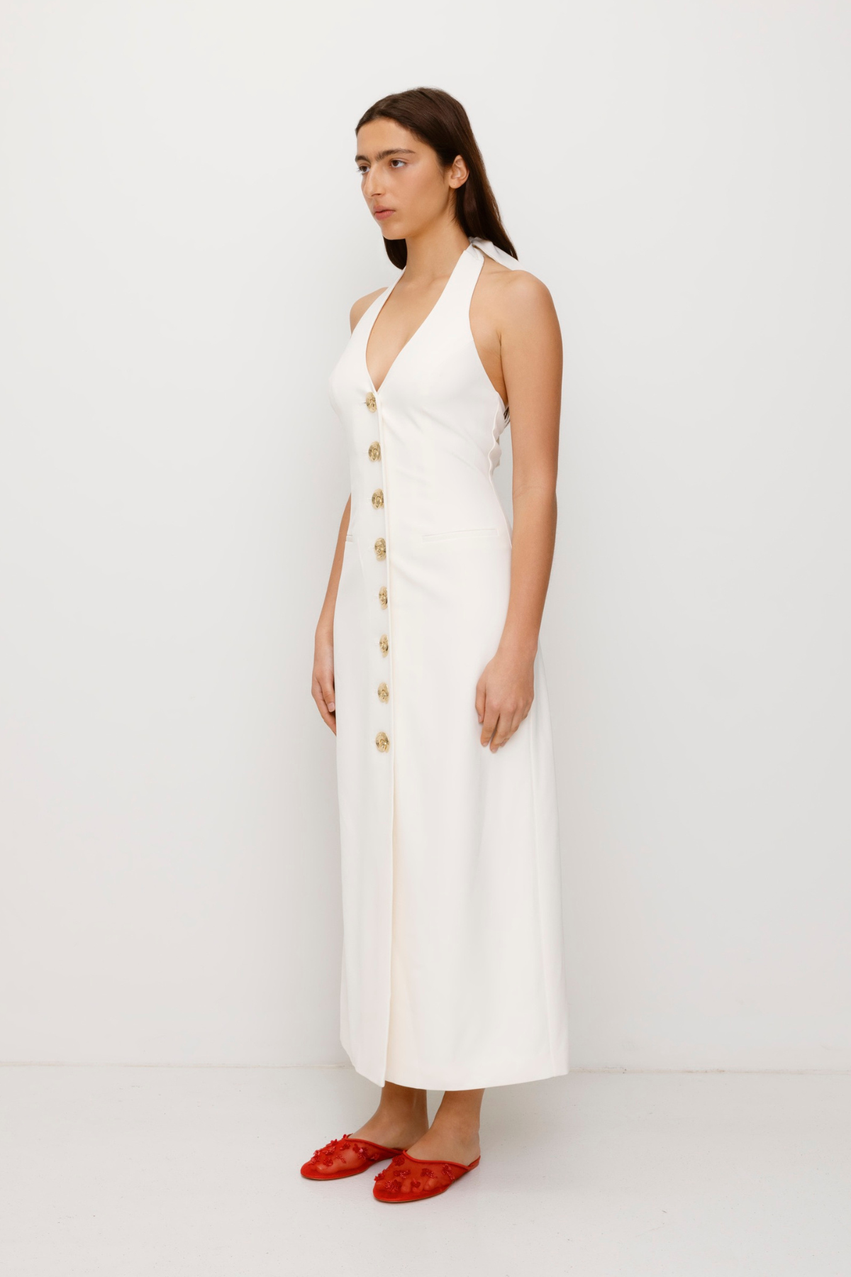 Women’s fitted maxi vest style dress in Ivory White with halter neck tie back gold swirl detailing and invisible back zip for a flattering fit and perfect for brides.