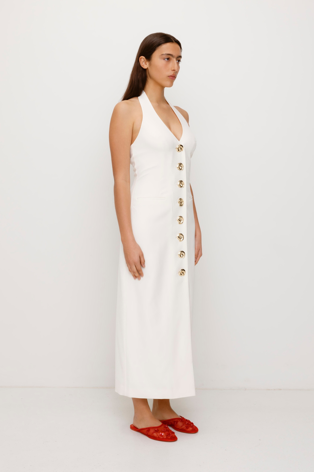 Women’s fitted maxi vest style dress in Ivory White with halter neck tie back gold swirl detailing and invisible back zip for a flattering fit and perfect for brides.