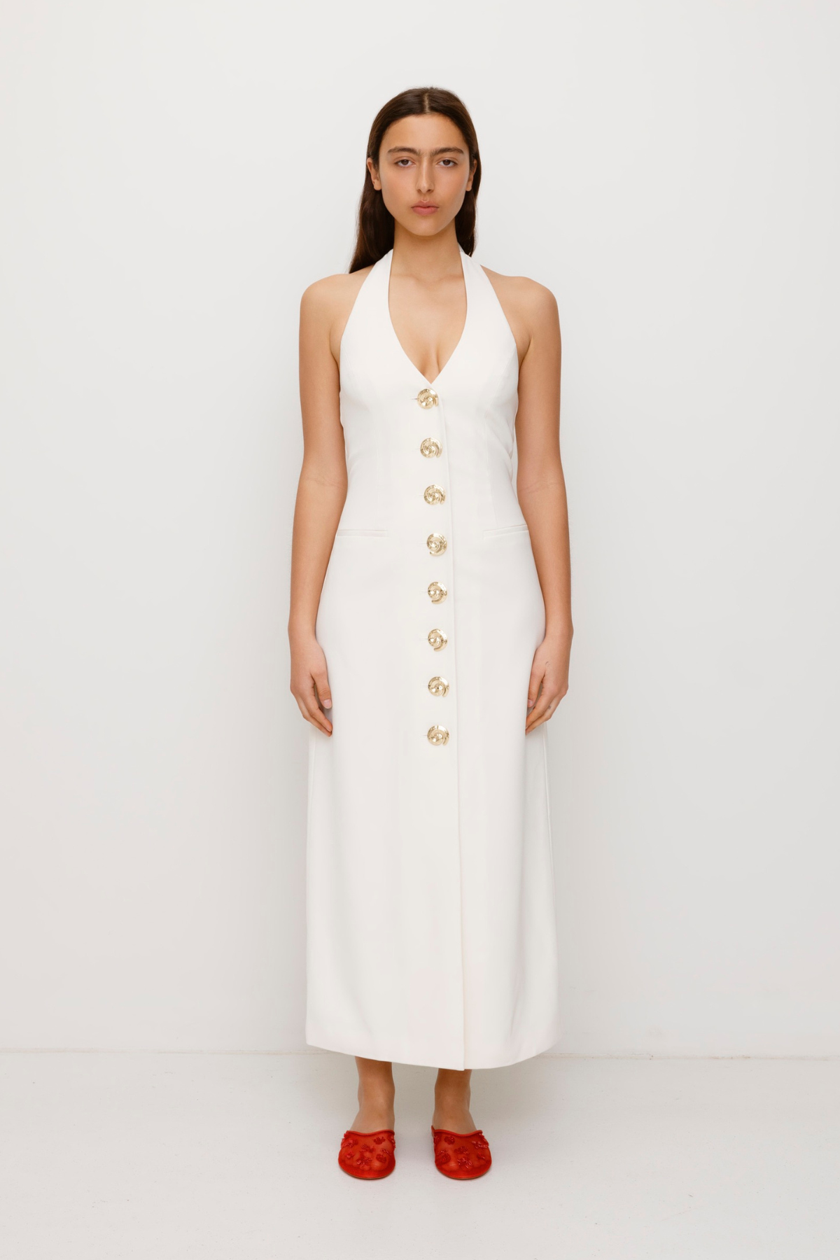 Women’s fitted maxi vest style dress in Ivory White with halter neck tie back gold swirl detailing and invisible back zip for a flattering fit and perfect for brides.