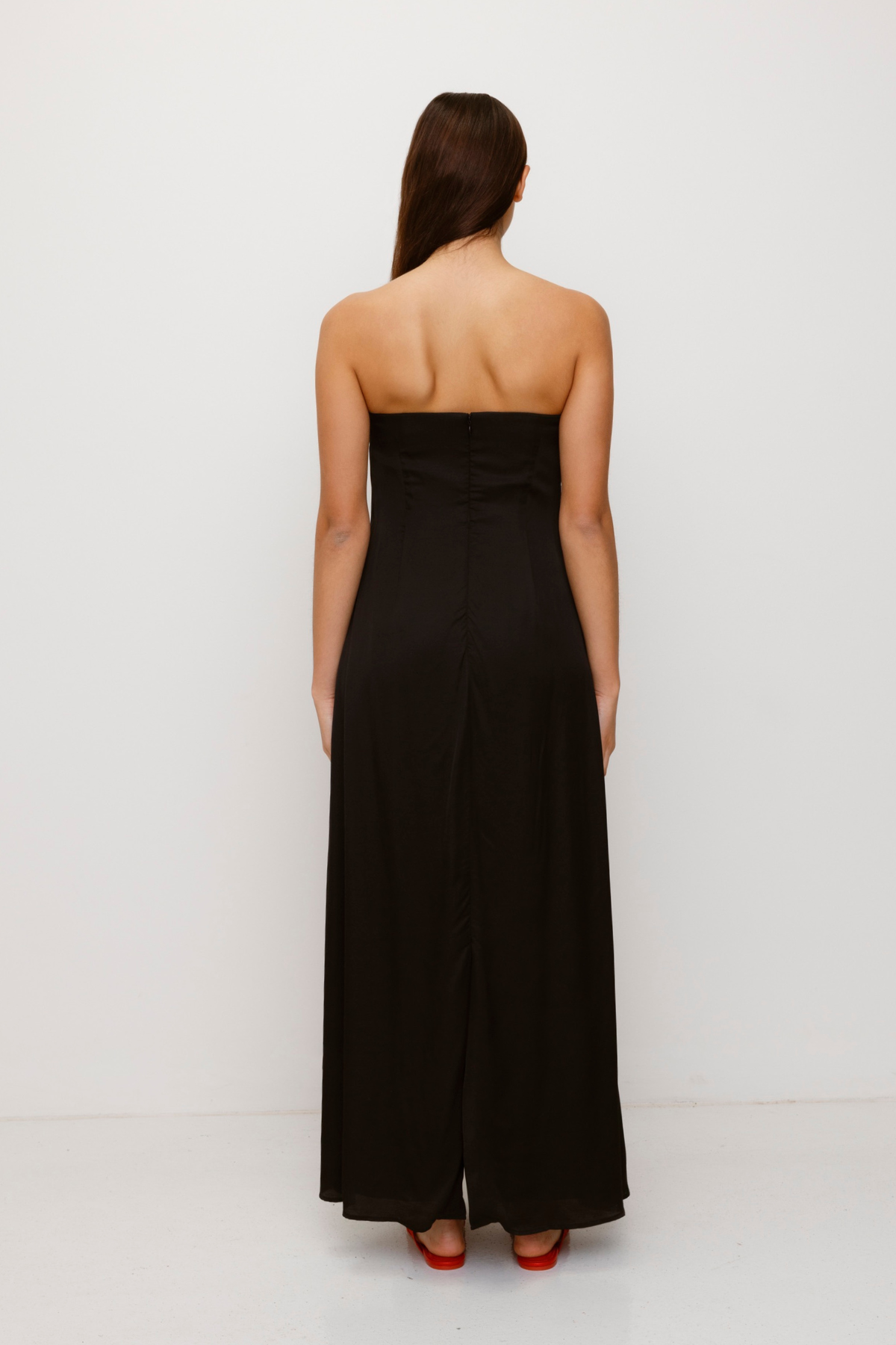 Women’s strapless Black Noir Kora Maxi Dress with asymmetric cowl neckline, abstract print, and invisible zip—perfect for events or long lunches.