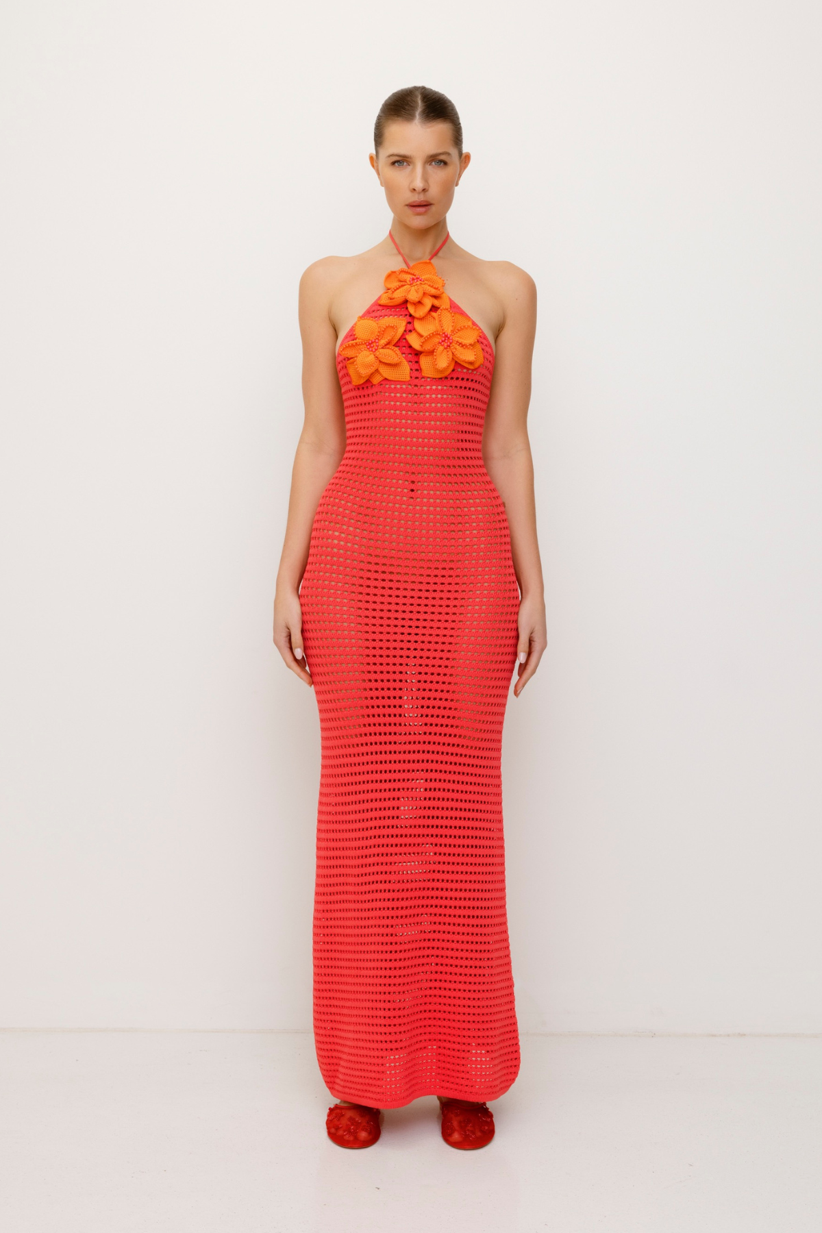 Bright halterneck knit maxi dress with 3D beaded crochet flowers and body-hugging fit.