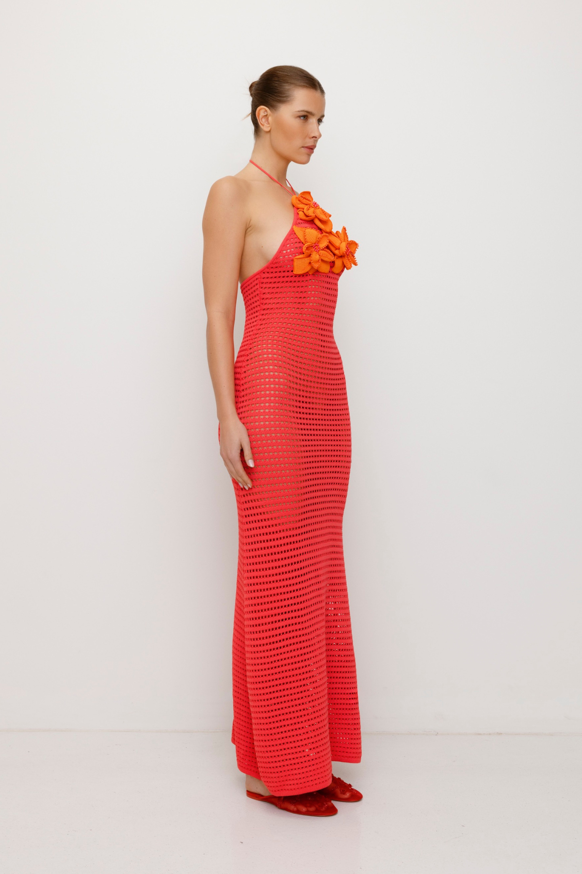 Bright halterneck knit maxi dress with 3D beaded crochet flowers and body-hugging fit.