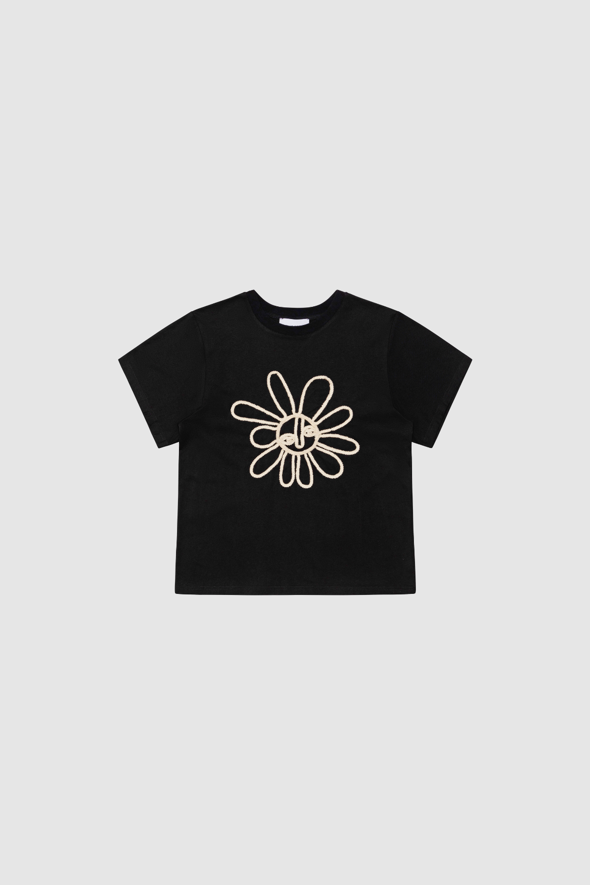Black cotton t-shirt with rope embroidery and relaxed fit.