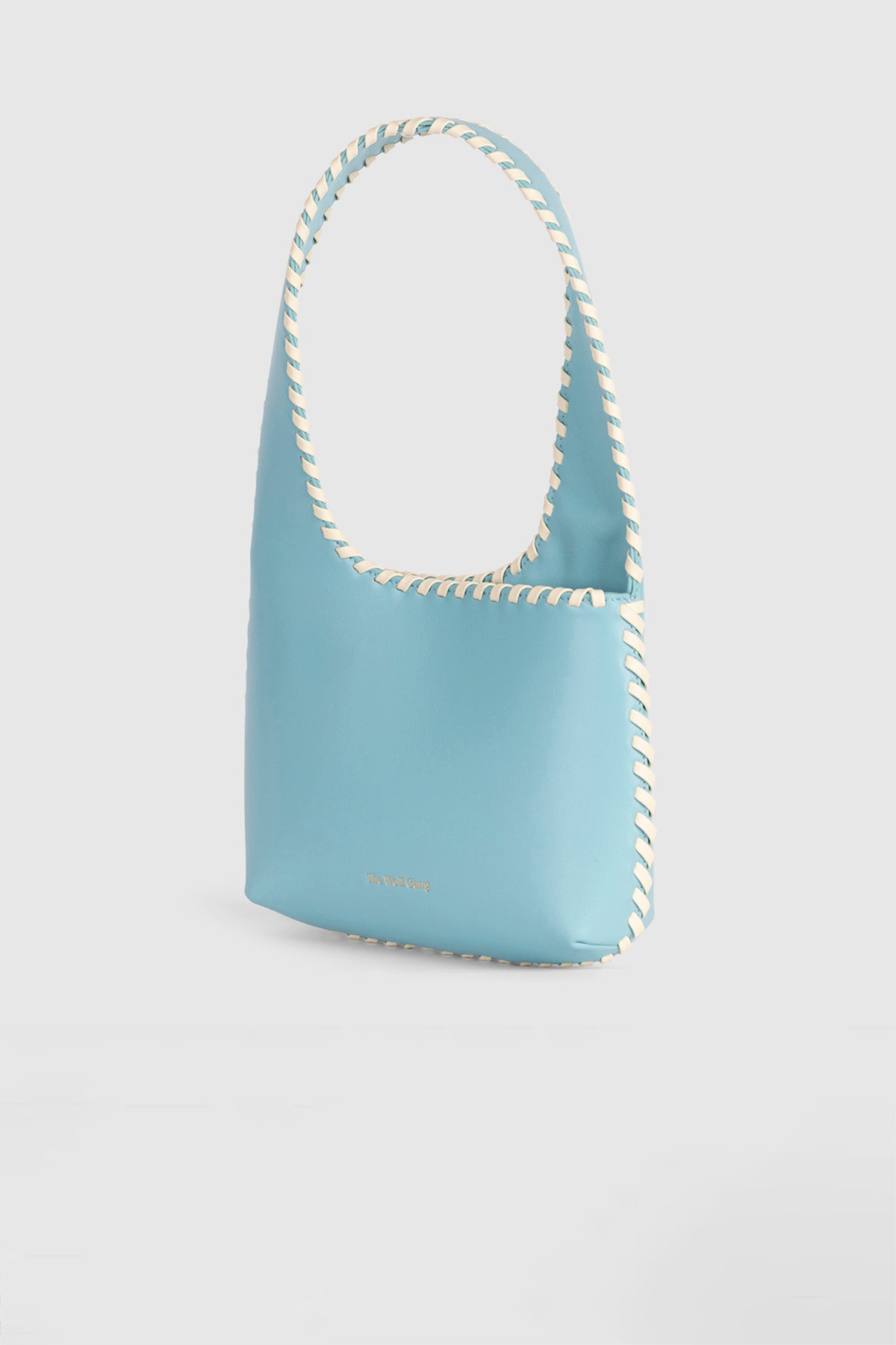 Women’s Aqua Blue Mara Shoulder Bag in 100 percent leather with twisted strap contrast binding and magnetic snap closure for everyday wear.