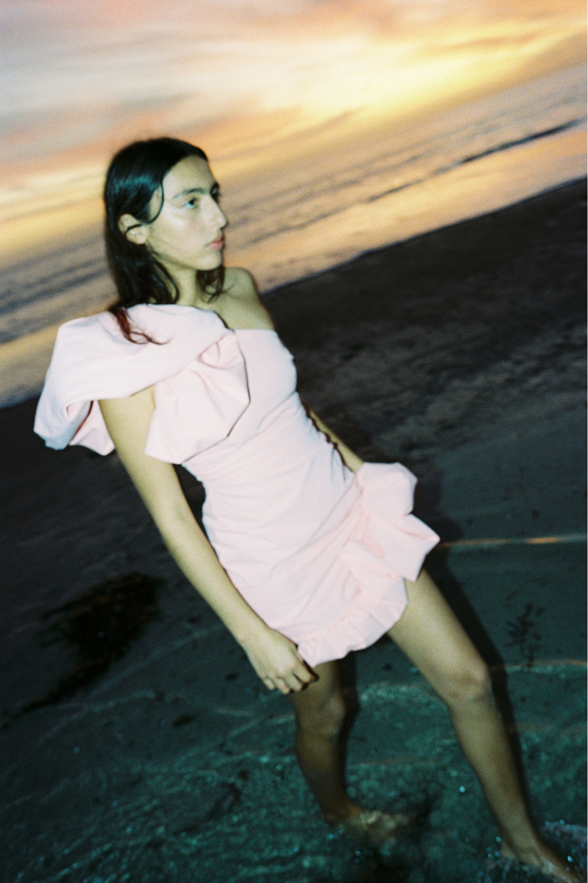 Women’s one shoulder Pink Salmon Octavia Mini Dress with puff shoulder detail ruffled hem rouched body and invisible back zip for easy wear.