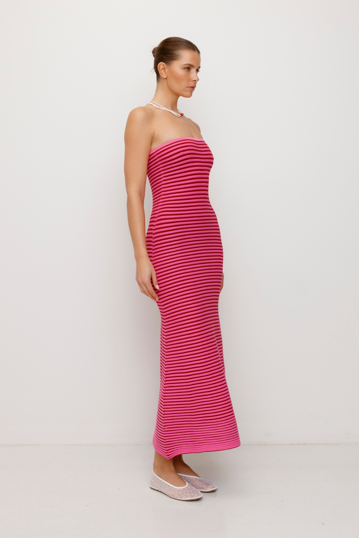 Pink strapless tonal stripe knit maxi dress with body-con fit, perfect for maternity or event wear.