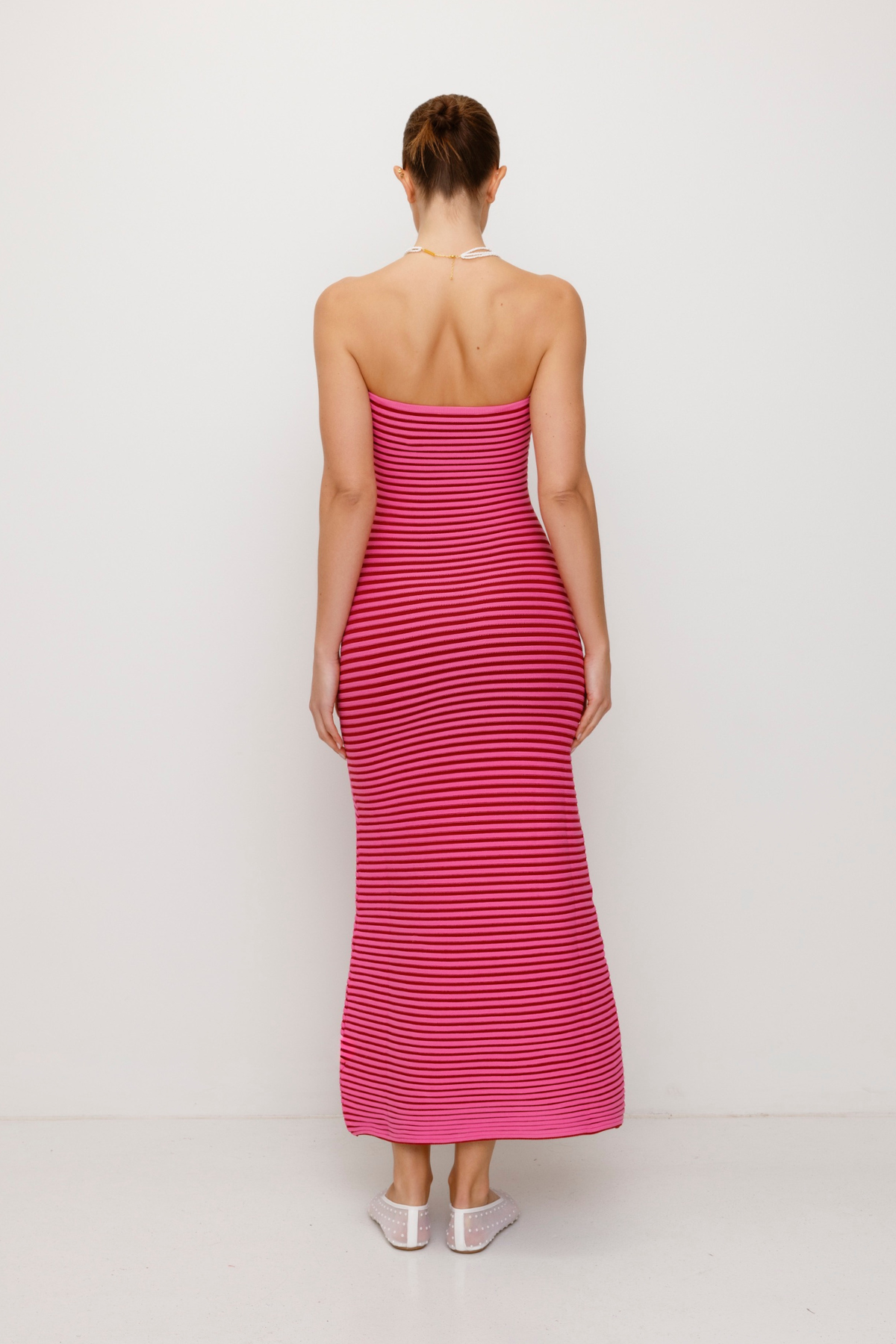 Pink strapless tonal stripe knit maxi dress with body-con fit, perfect for maternity or event wear.