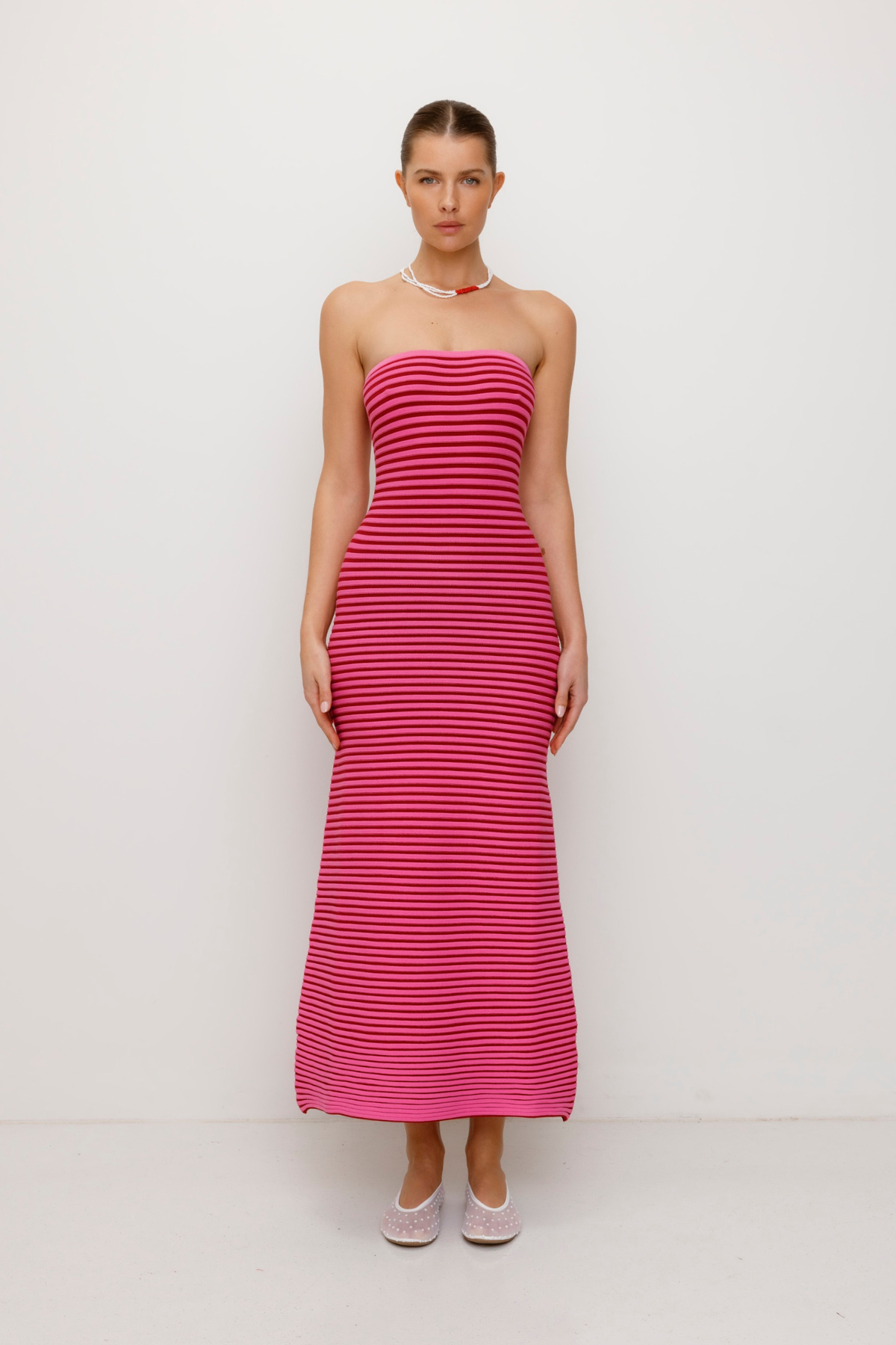 Pink strapless tonal stripe knit maxi dress with body-con fit, perfect for maternity or event wear.