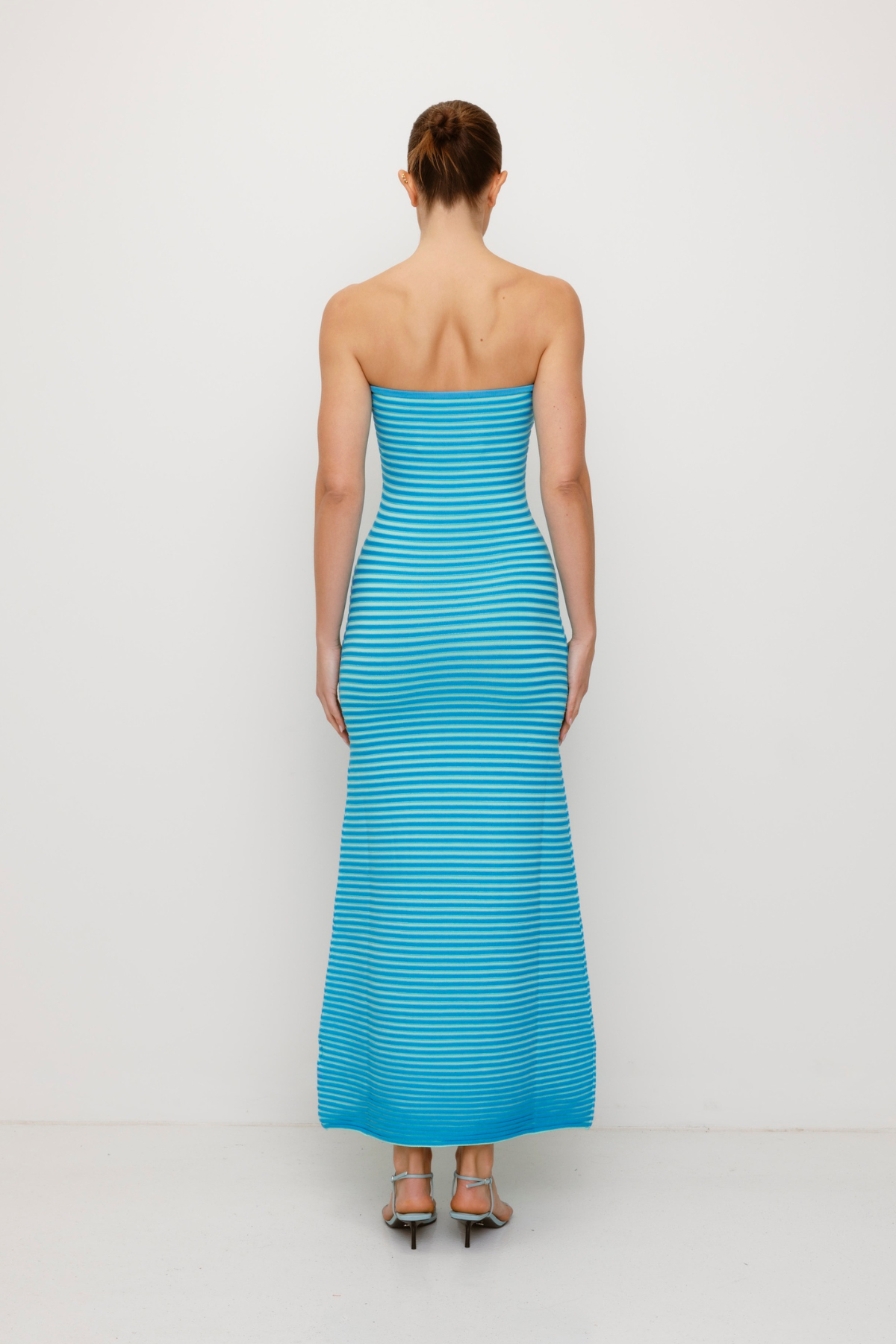 Blue strapless tonal stripe knit maxi dress with body-con fit, perfect for maternity or event wear.