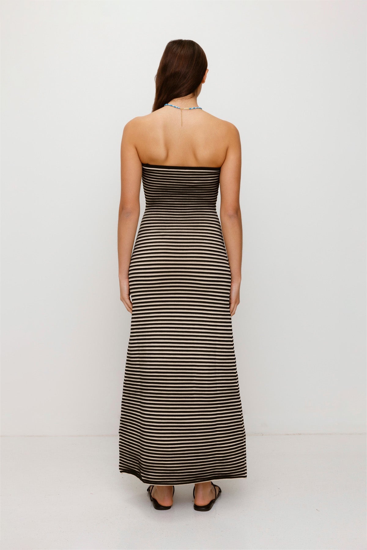 Black & White strapless tonal stripe knit maxi dress with body-con fit, perfect for maternity or event wear.