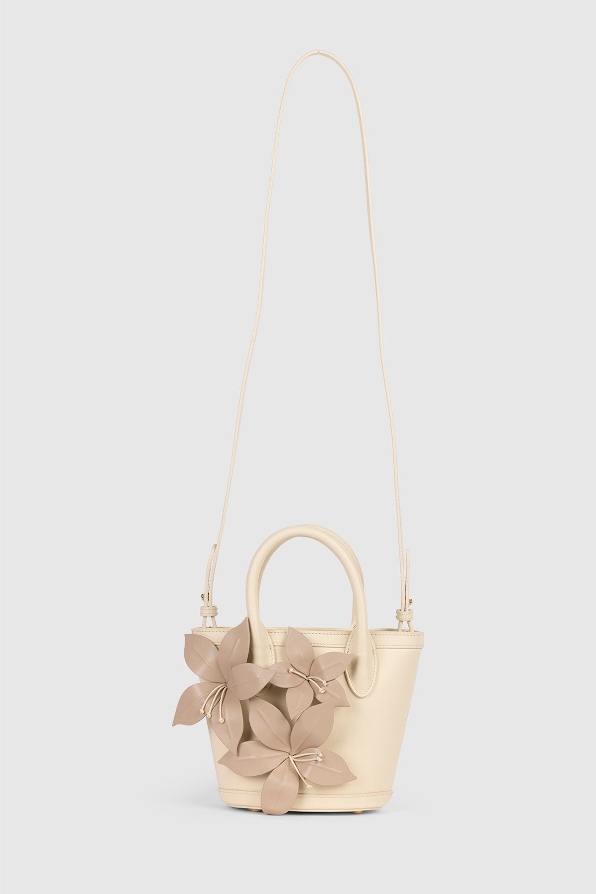 Womenās Cream La Monada Flower Bag in structured leather with floral embellishments dual top handles and crossbody option for day to night wear