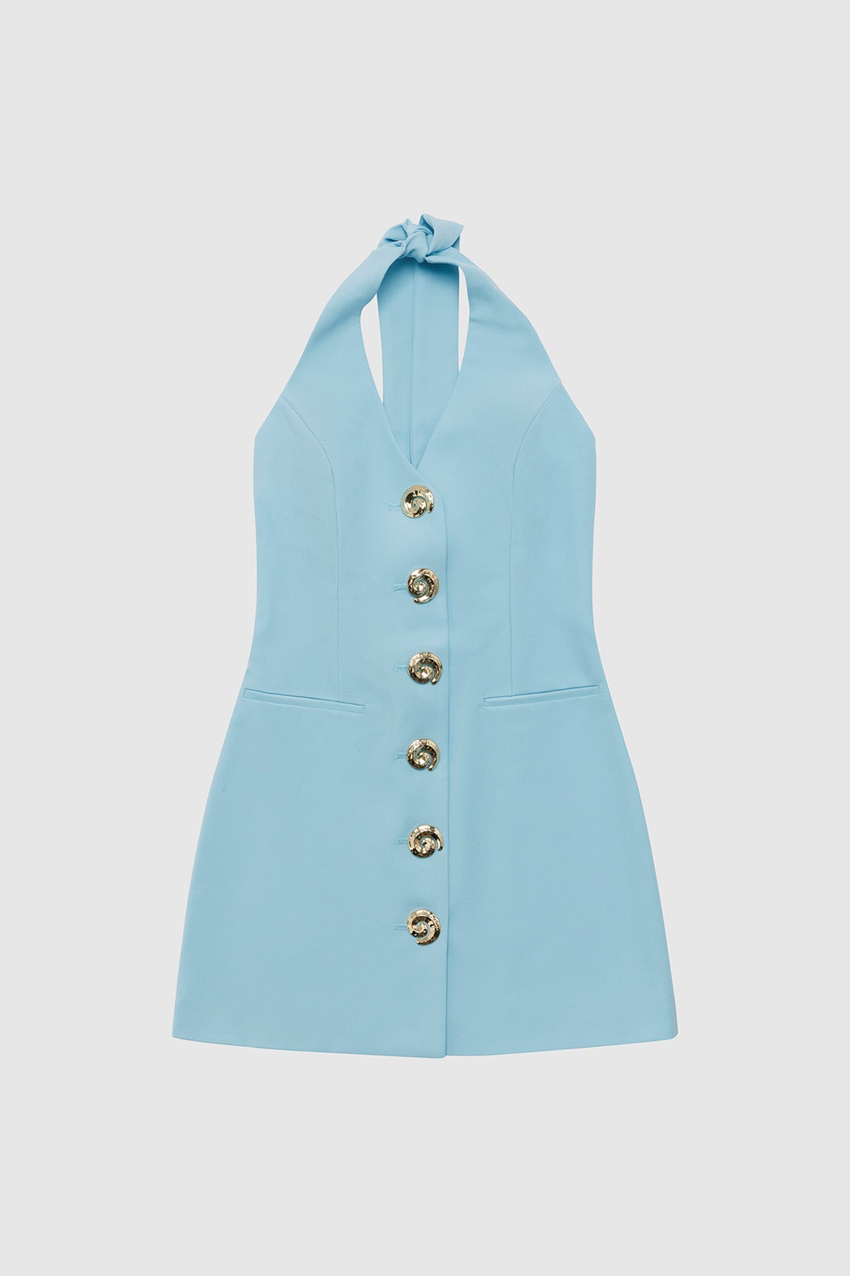 Best-selling women’s Sky Blue Irida mini halter neck vest dress with gold swirl buttons, tie-back, and front welt pocket—wear alone or with matching pants.