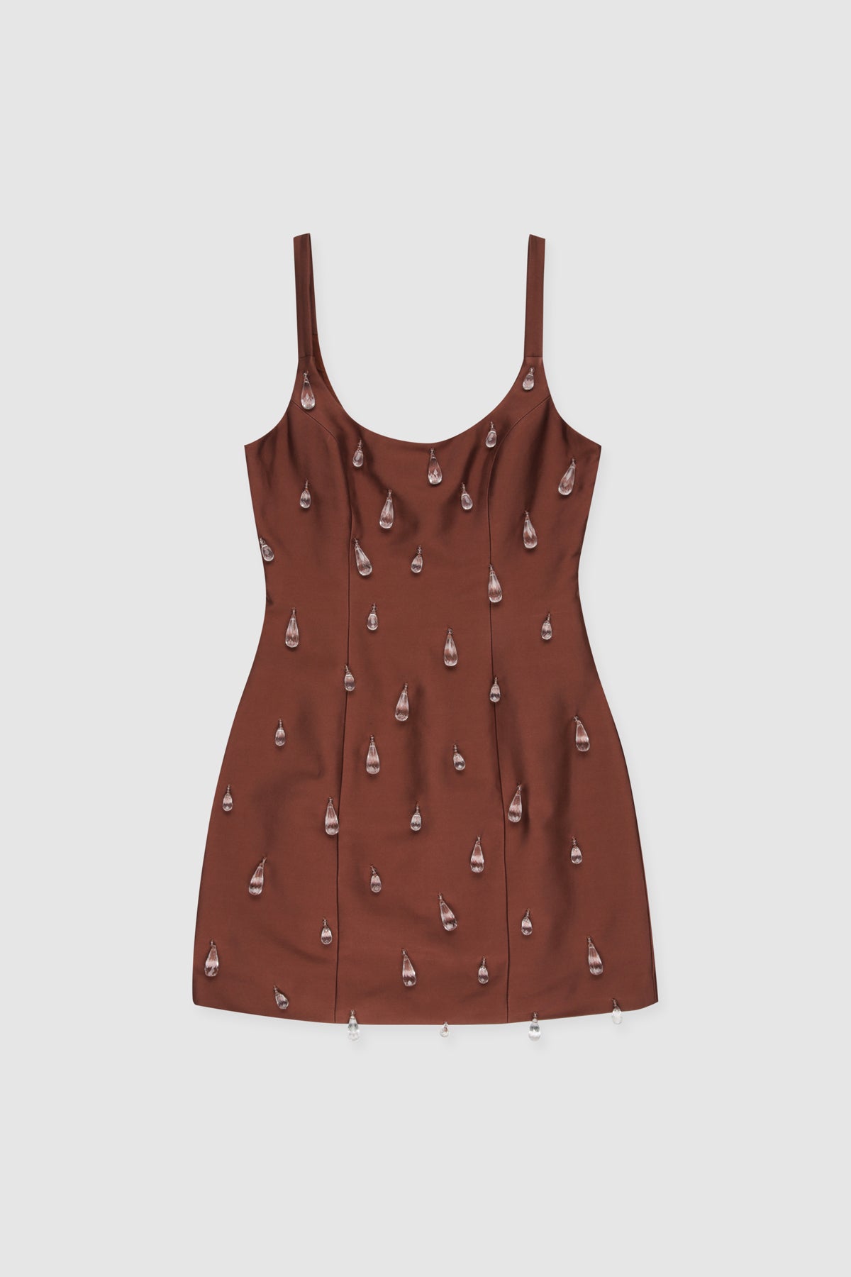 Woman wearing brown beaded mini dress with satin finish and teardrop embellishments
