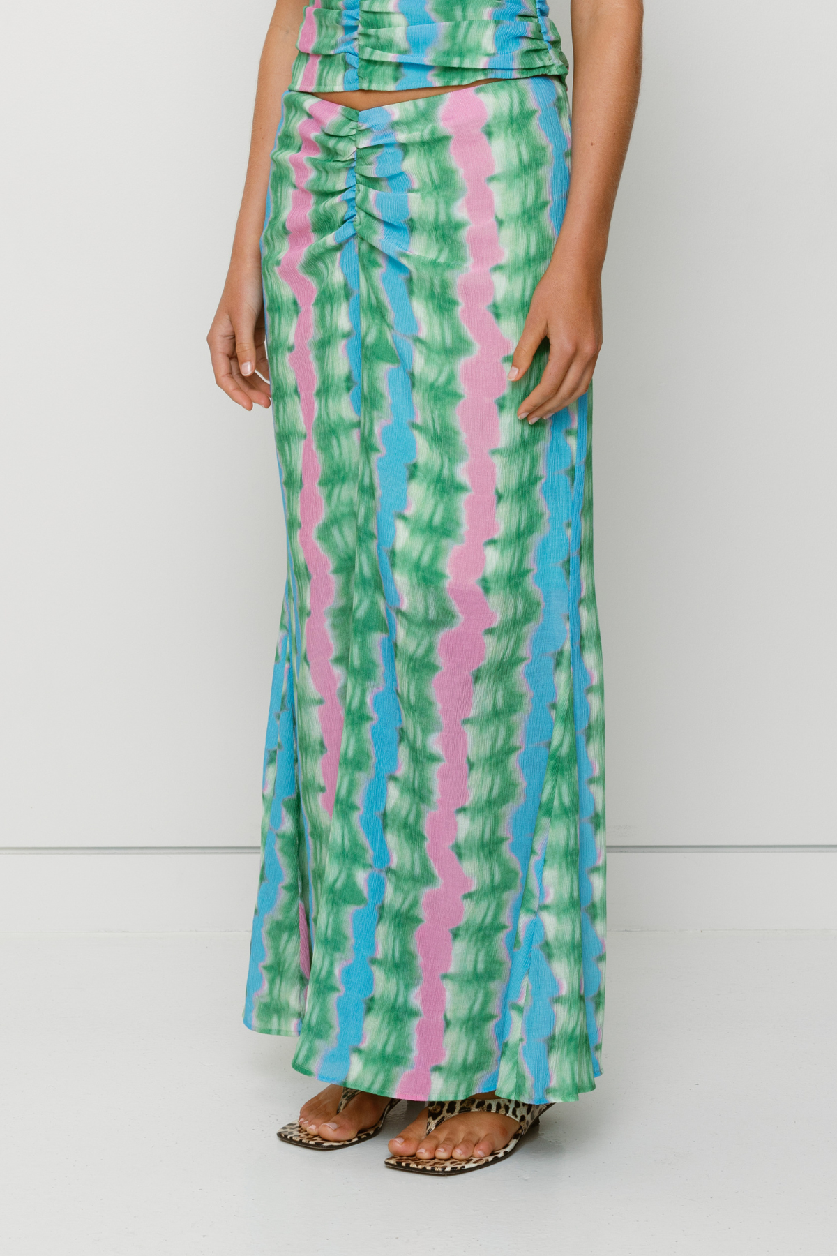 Women's tie-dye maxi skirt by The Wolf Gang, styled to match the ruched Catia Top for an effortless coordinated outfit.