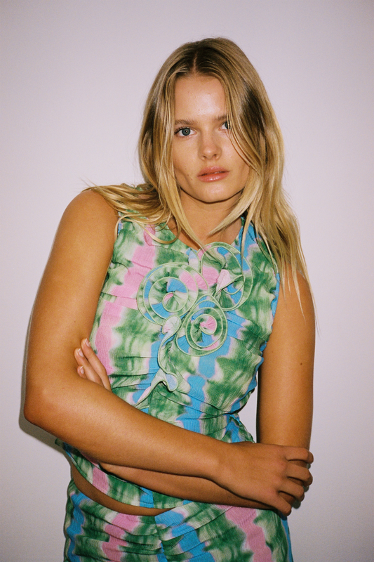 Women's ruched tie-dye top with 3D floral details by The Wolf Gang, perfect with jeans or matching skirt.