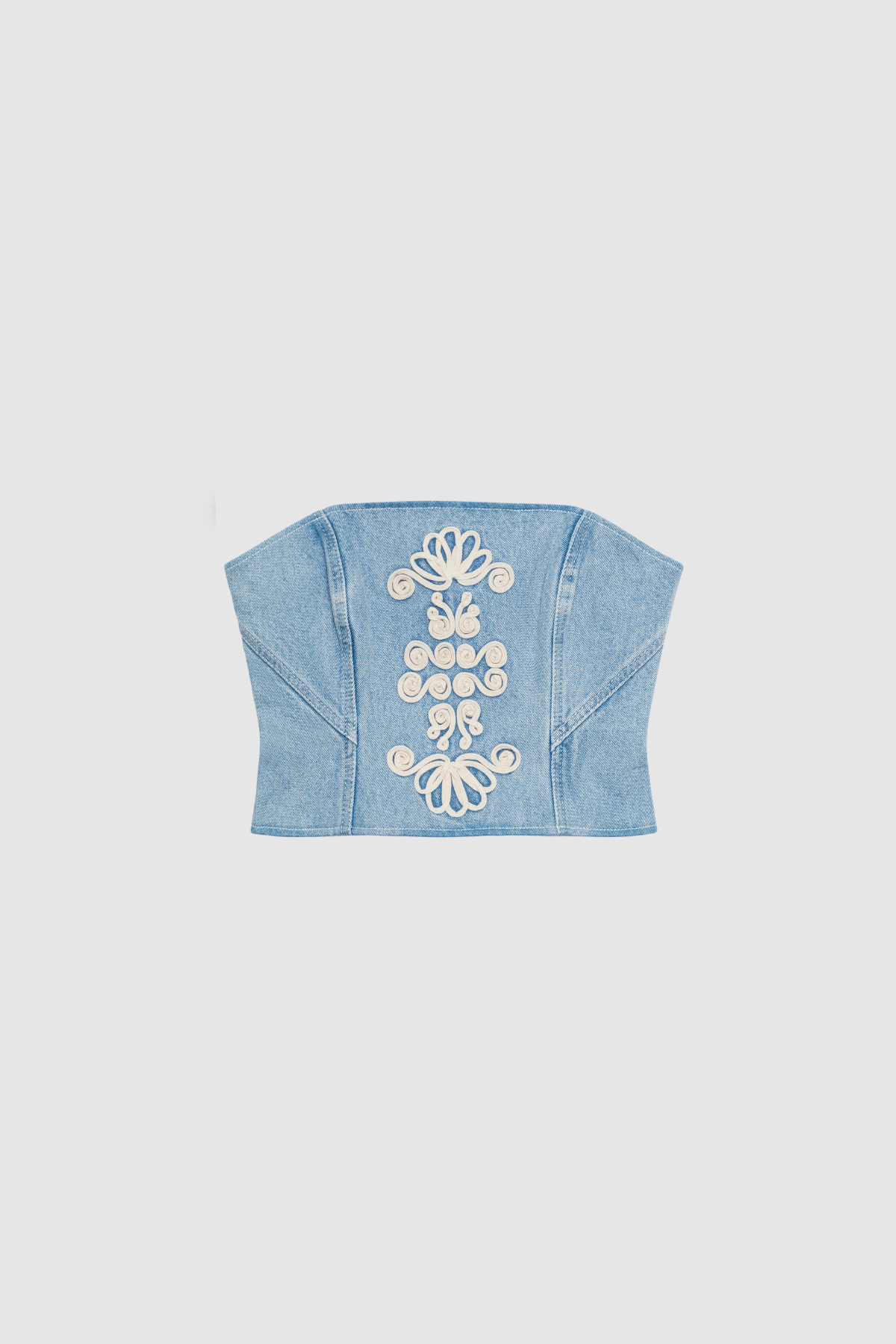 Corset-style denim bustier with boning, functional zip, and custom TWG embroidery by The Wolf Gang, pairs with matching denim jeans.