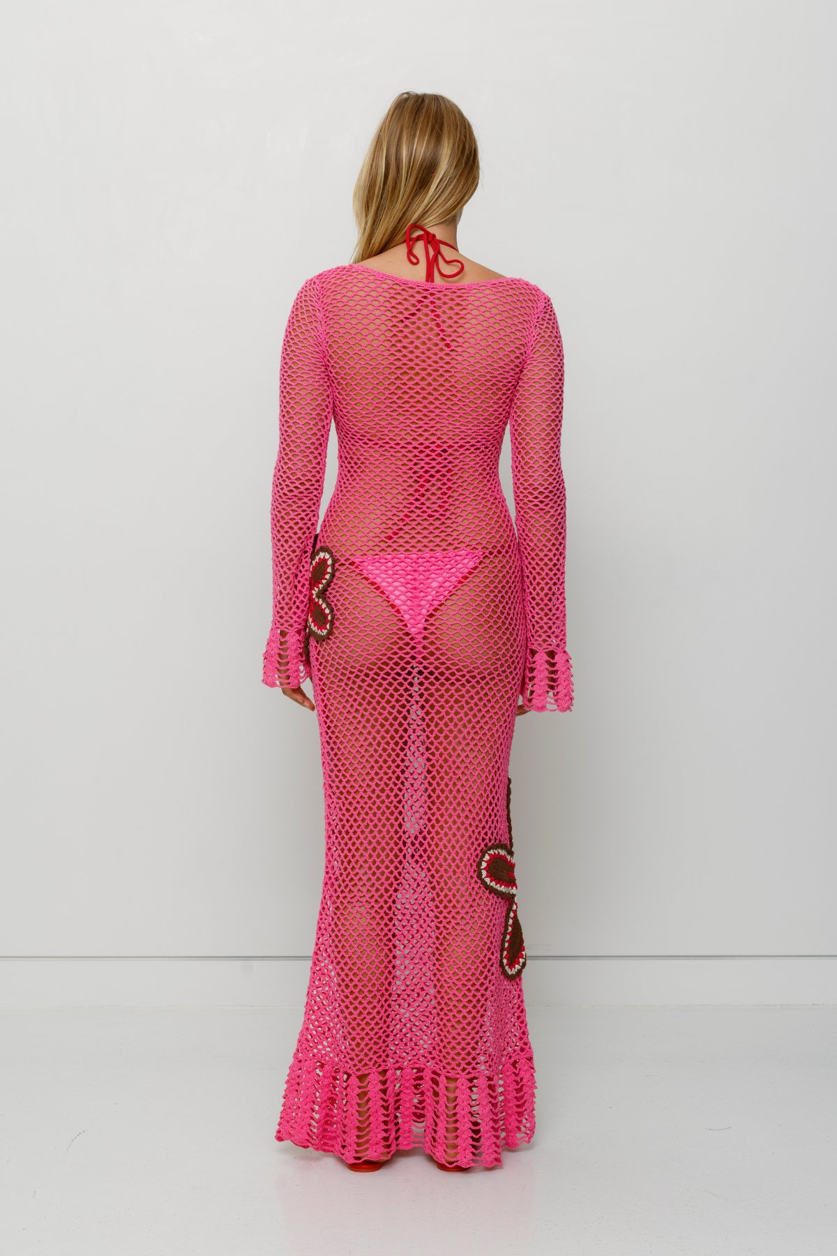 Pink hand-crocheted cotton maxi dress by The Wolf Gang, artisan made in Bali, perfect as a luxe bikini cover-up.