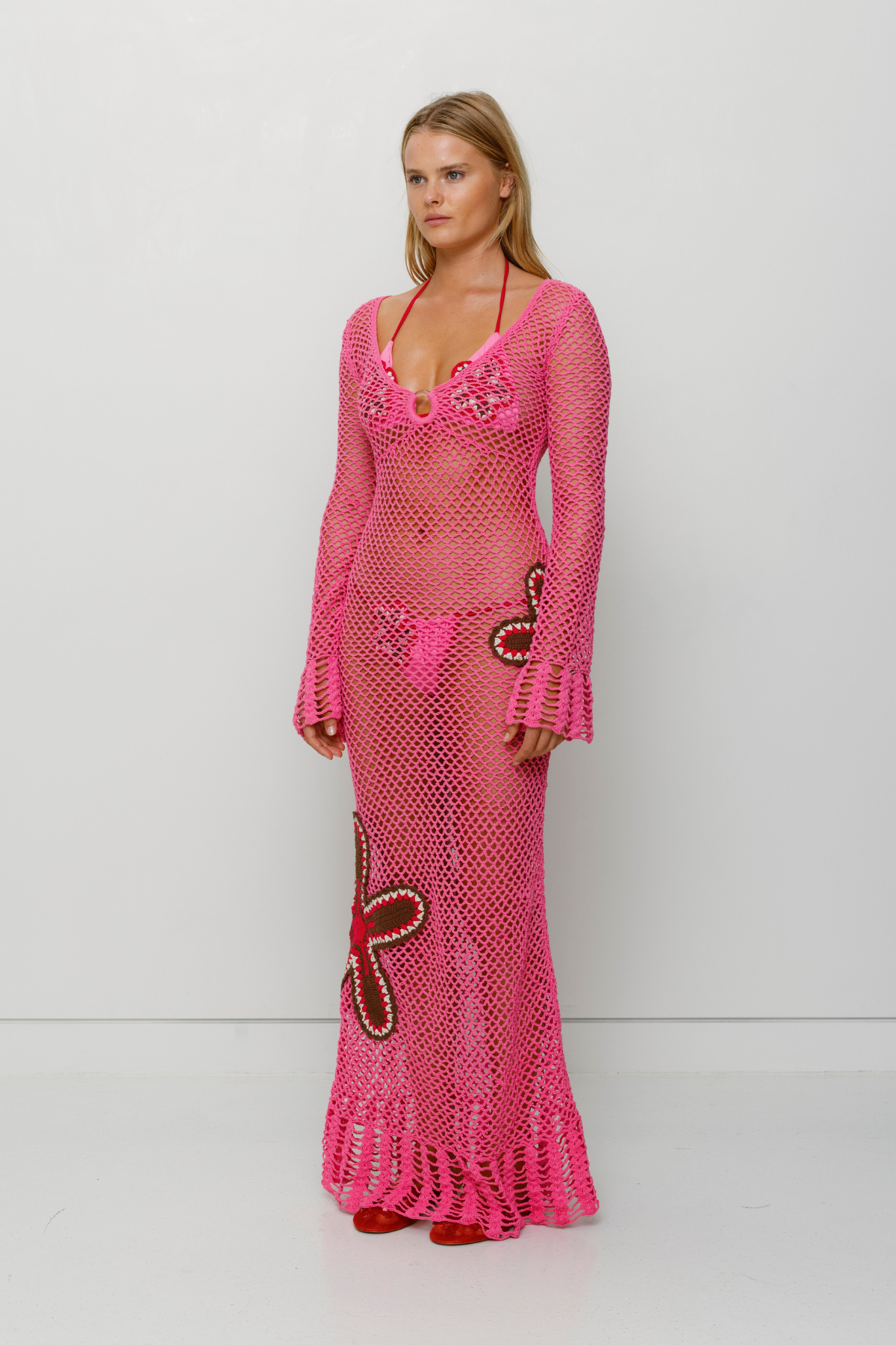 Pink hand-crocheted cotton maxi dress by The Wolf Gang, artisan made in Bali, perfect as a luxe bikini cover-up.