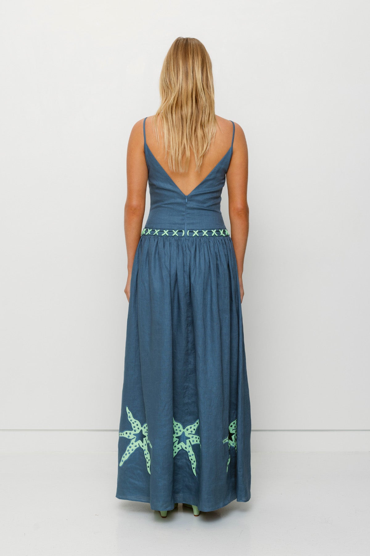 Women's stone blue cotton maxi dress with roped neckline by The Wolf Gang, elegant and versatile for day or evening wear.