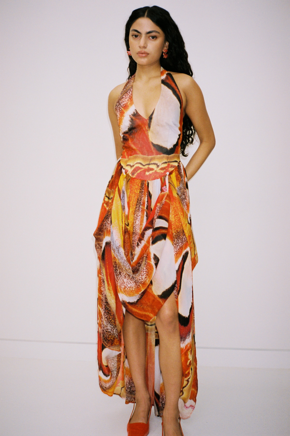 Versatile sheer Rumi Maxi Dress with adjustable skirt buttons by The Wolf Gang, customizable length for day or night wear.