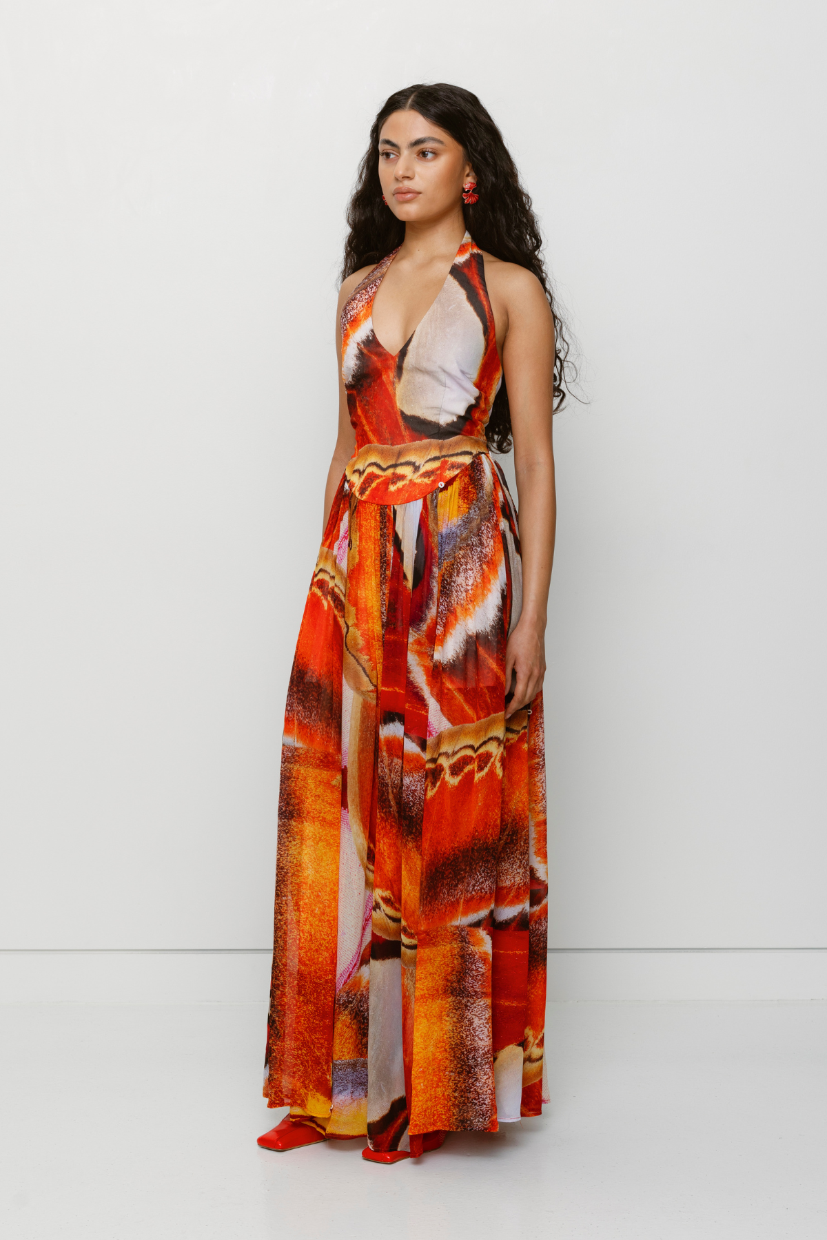 Versatile sheer Rumi Maxi Dress with adjustable skirt buttons by The Wolf Gang, customizable length for day or night wear.