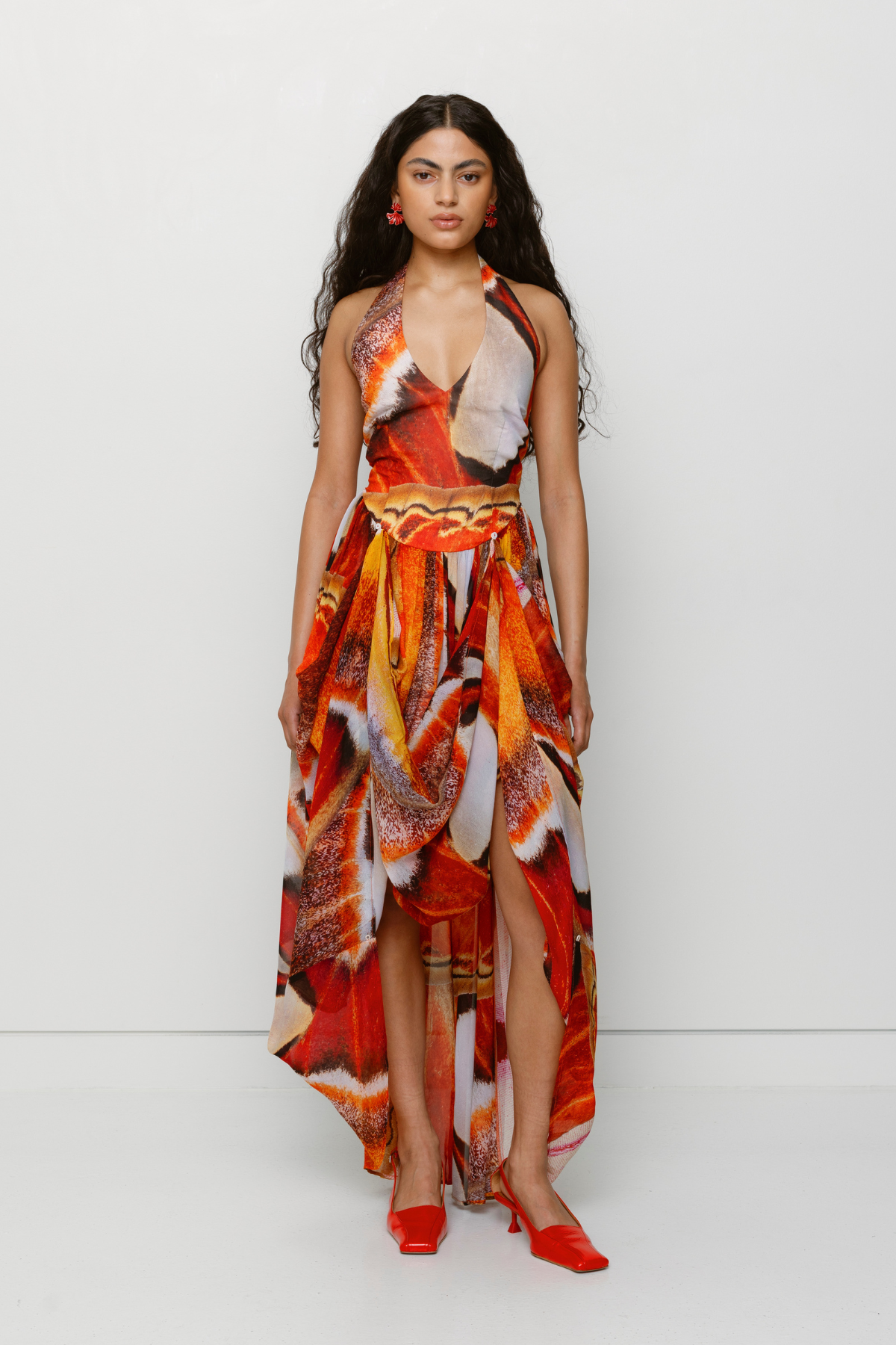 Versatile sheer Rumi Maxi Dress with adjustable skirt buttons by The Wolf Gang, customizable length for day or night wear.