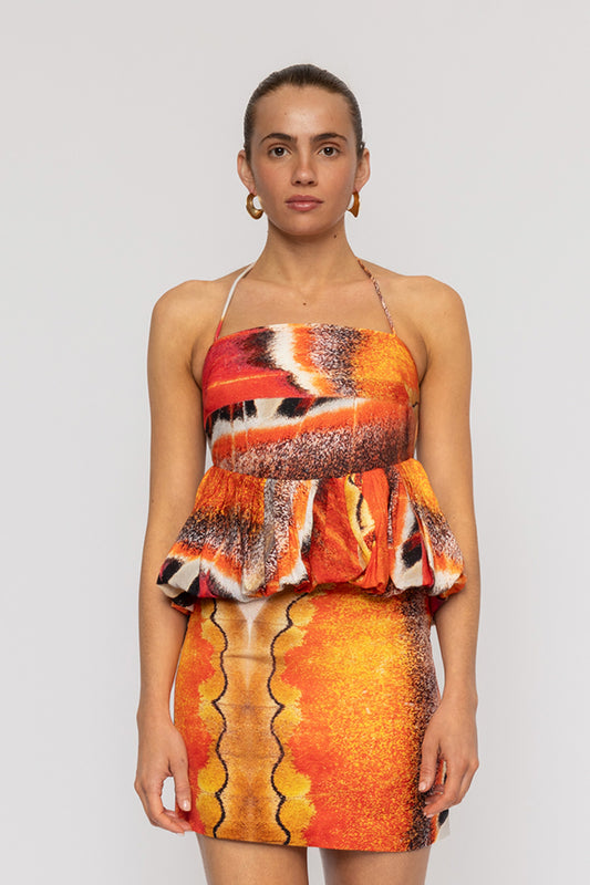 Orange multi-color halterneck blouse with bubble hem in custom TWG print by The Wolf Gang, pairs with matching skirt.