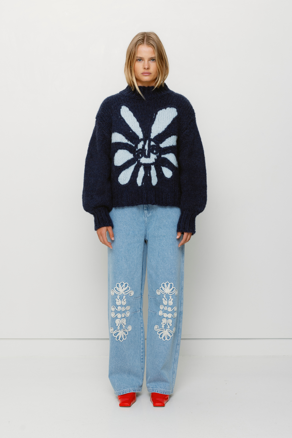 Cozy wool blend bell sleeve knit sweater with relaxed fit and custom TWG pattern, perfect for stylish winter layering.