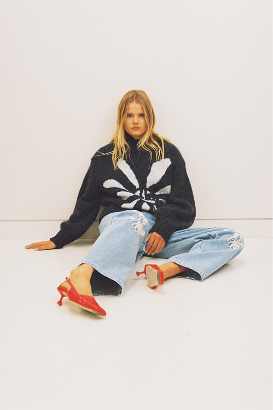 Cozy wool blend bell sleeve knit sweater with relaxed fit and custom TWG pattern, perfect for stylish winter layering.