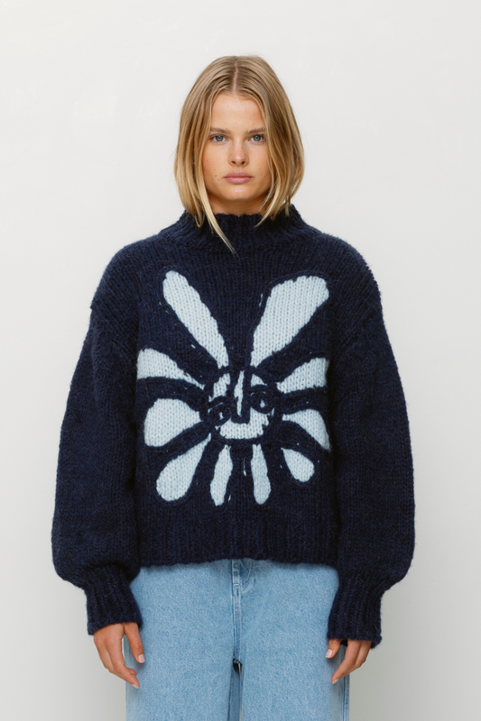 Cozy wool blend bell sleeve knit sweater with relaxed fit and custom TWG pattern, perfect for stylish winter layering.