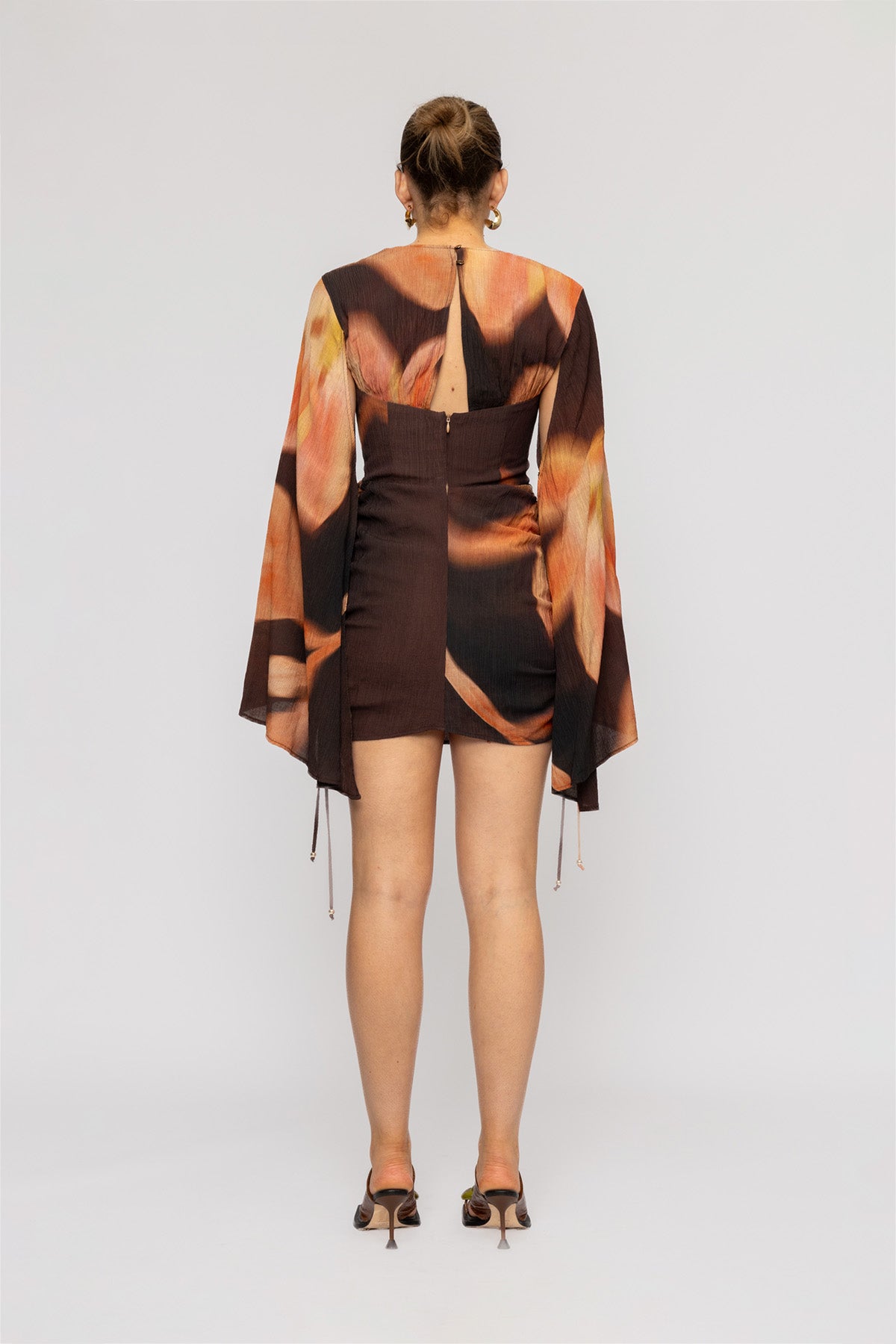 Women's Brown Floral mini dress with ruched skirt and cape sleeves by The Wolf Gang, perfect for parties and nights out.