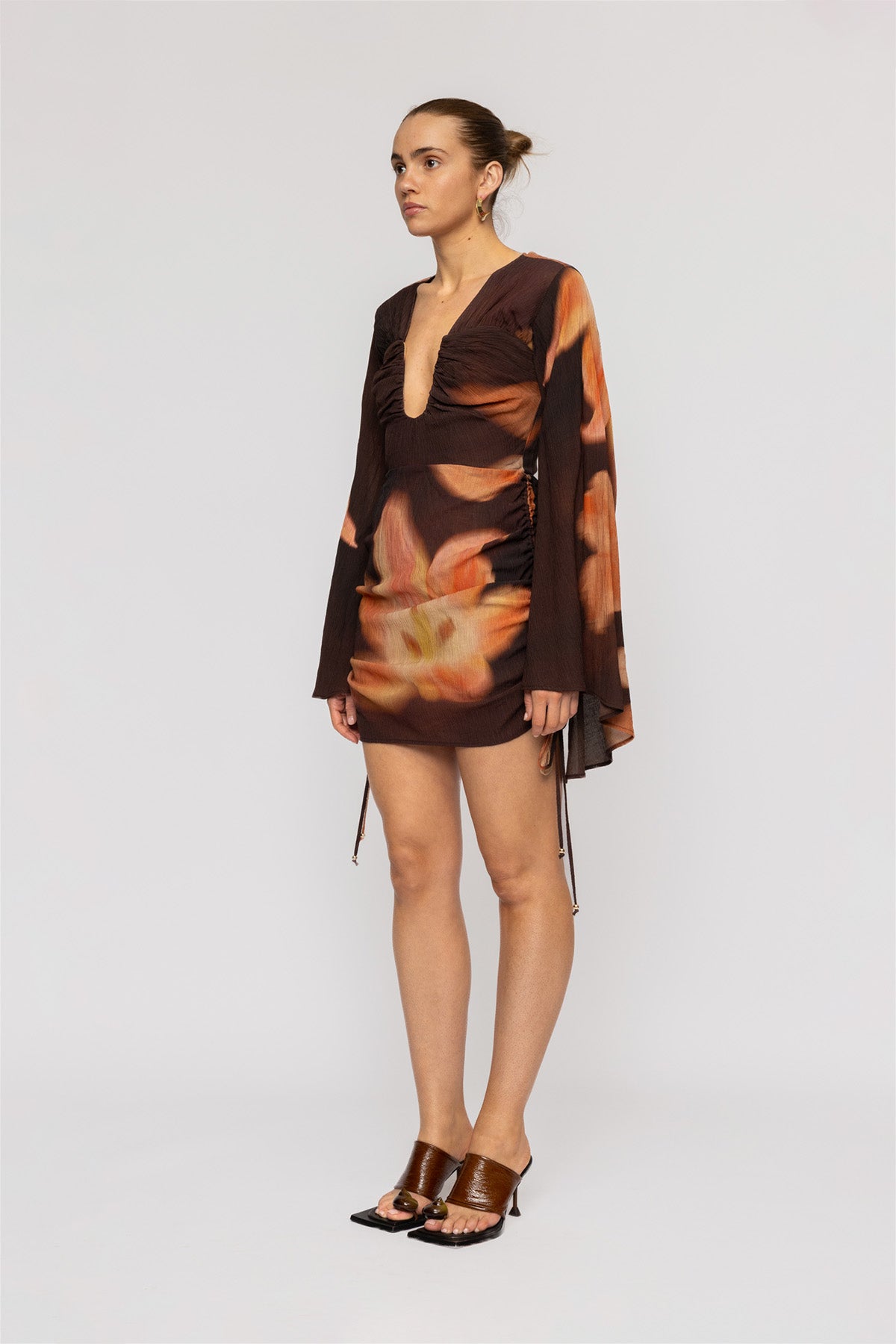 Women's Brown Floral mini dress with ruched skirt and cape sleeves by The Wolf Gang, perfect for parties and nights out.