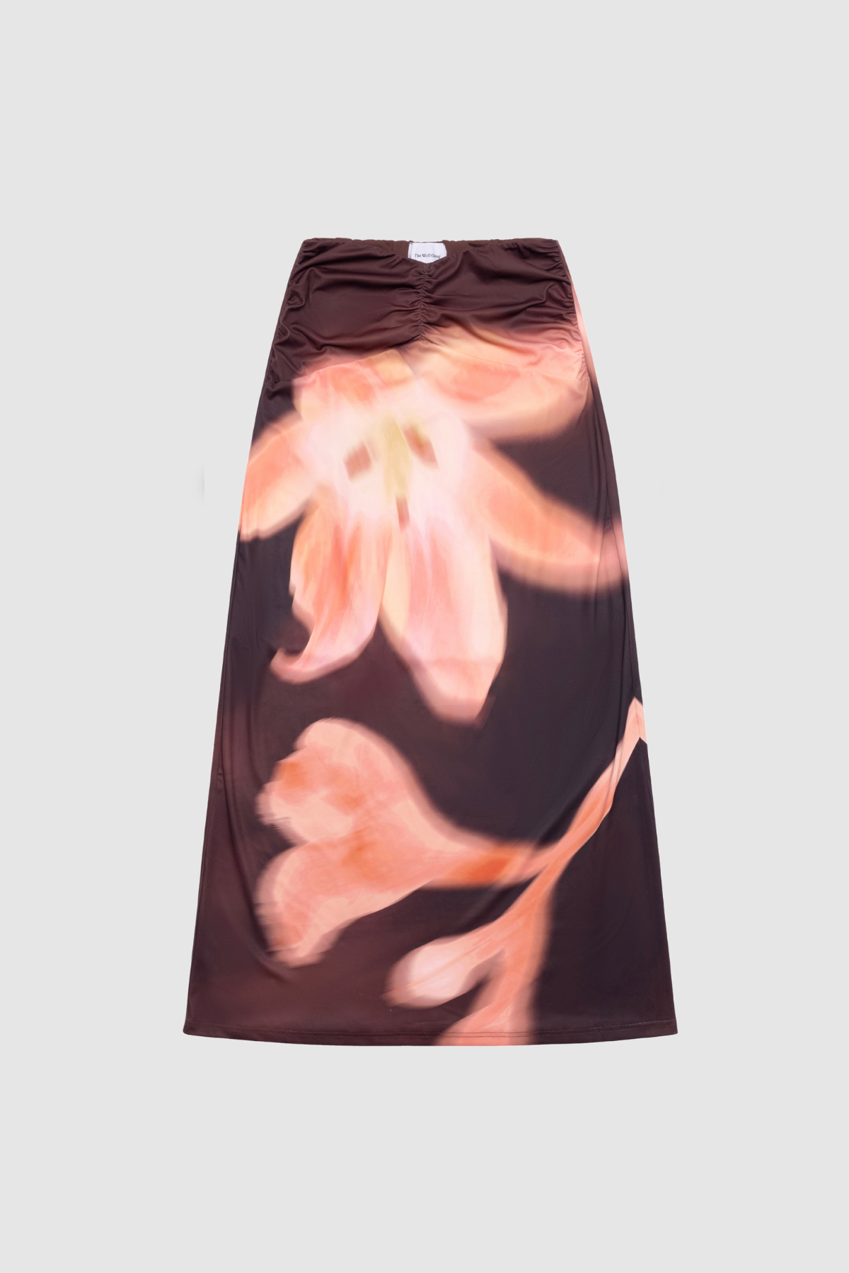 Brown floral print ruched maxi skirt with figure-hugging fit by The Wolf Gang, pairs with matching Veda Top for an event-ready look.