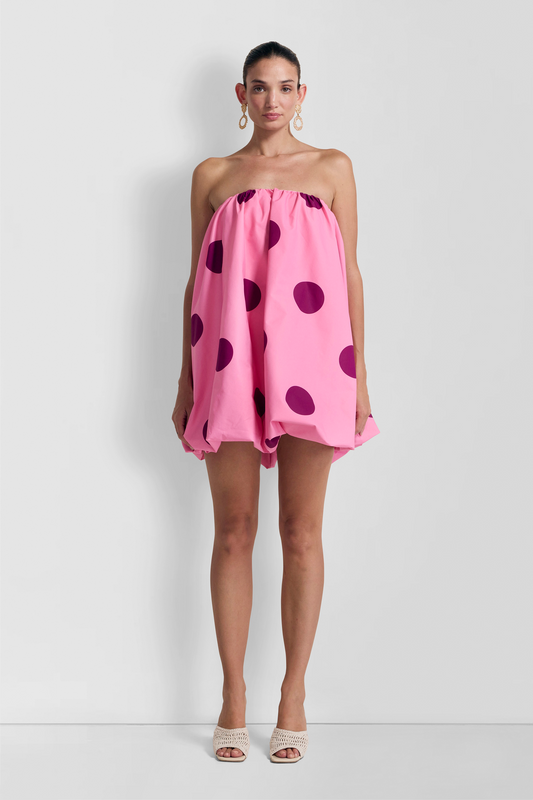 Women’s spotted mini dress with bubble hem, back zip, and internal bra support.