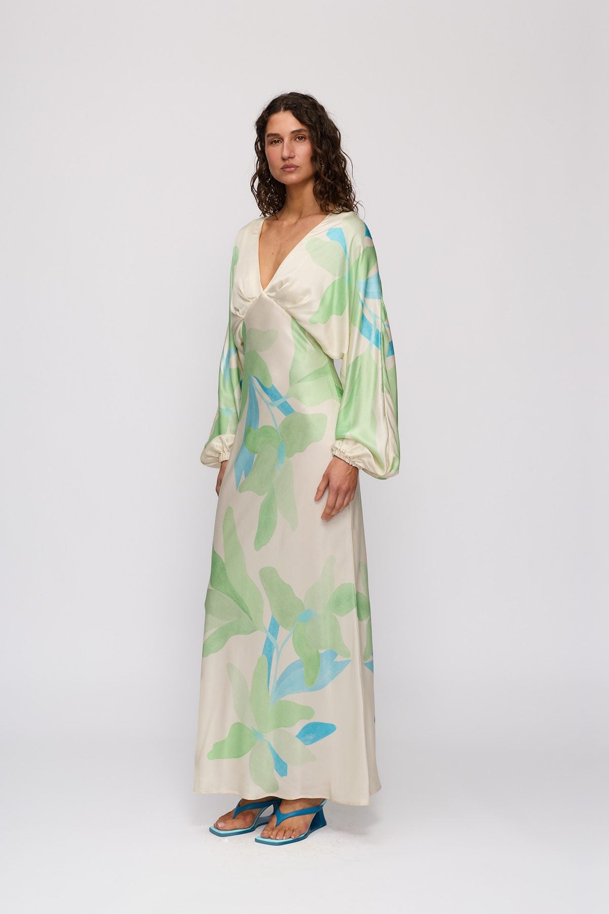 Concha Maxi Dress in Ocean Lily by The Wolf Gang – three-quarter side view