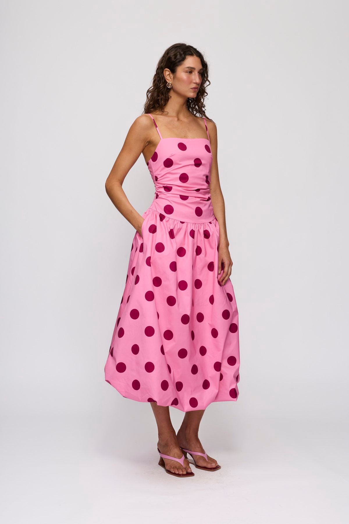 Gaia Bubble Maxi Dress in Candy Spot by The Wolf Gang – side view with pocket